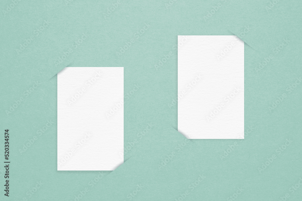 two blank white paper on grunge green background for announcement, promotion advertisement concept two blank white paper on grunge green background for announcement, promotion advertisement concept