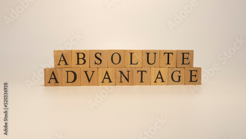 absolute advantage sentence written on wooden surface. Economy and concept.