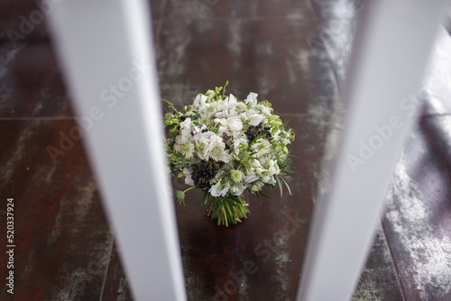 Fototapeta Naklejka Na Ścianę i Meble -  Wedding bouquet stands on the vintage floor