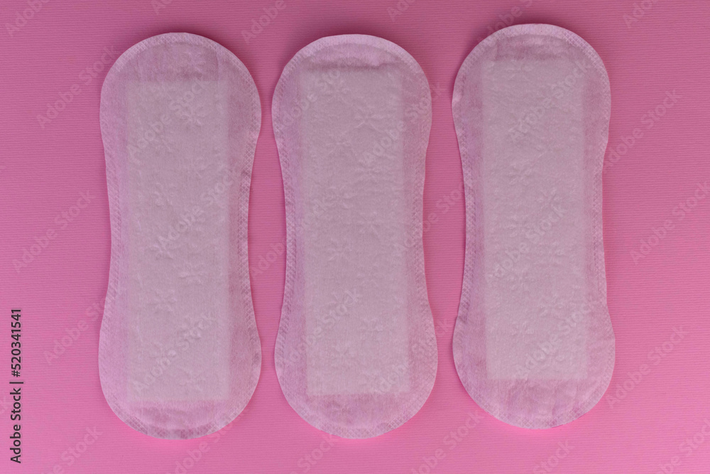 Women's sanitary pads on a pink background.
Women's sanitary pads on a pink background.
