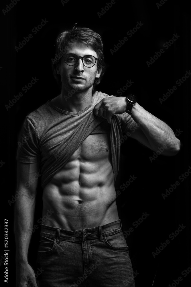 Muscular man on black background