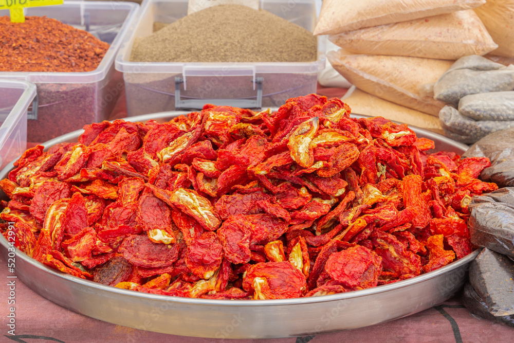 Red dried hot peppers are sold on a street stall. Close-up Red dried hot peppers are sold on a street stall. Close-up