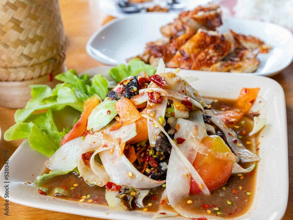 Somtum Luang prabang style, Papaya salad with background of grilled