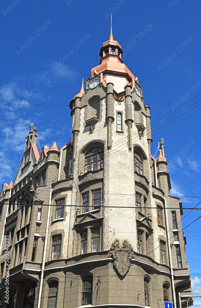 Fototapeta premium House of city institutions (1904-1906), house with high tower and coat of arms of St. Petersburg on corner of Sadovaya Street and Voznesensky Prospekt