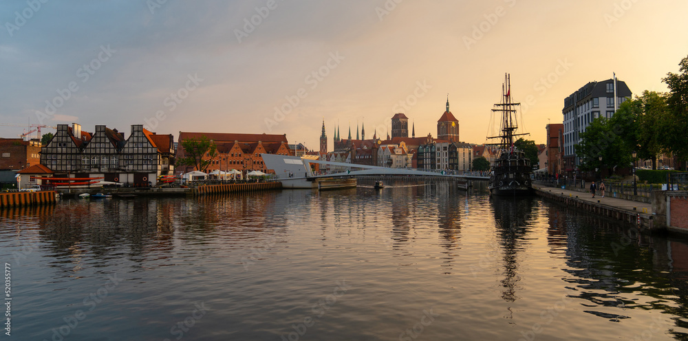 Scenic summer evening panorama of the architectural embankment pier twilight sunset of the Old Town of GDANSK, POLAND