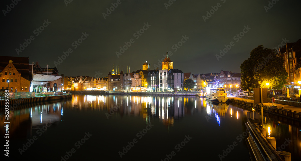Fototapeta premium Picturesque summer evening panorama of the architectural pier of the Old Town GDANSK, POLAND