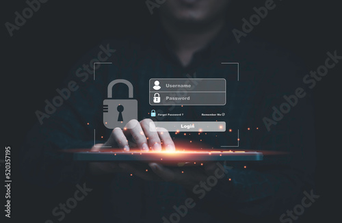 Businessman typing on keyboard laptop computer to input username and password for technology security system and protect hacker concept.