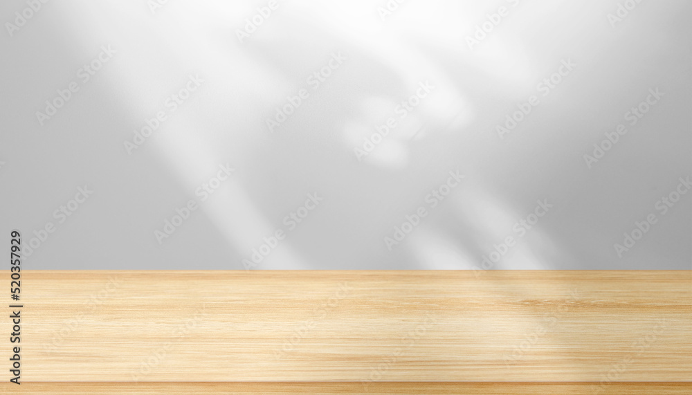 Blank brown table top, shelf in front of wall with abstract shadows, light Blank brown table top, shelf in front of wall with abstract shadows, light