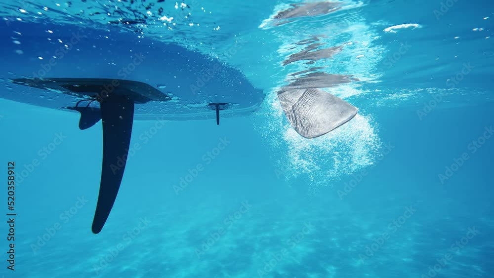 Paddle sup board from underwater 