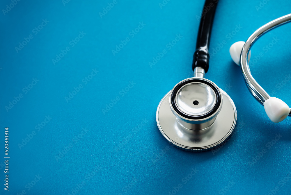 Close up stethoscope isolated on blue background with copy space, top view. Healthcare and medical concept. Close up stethoscope isolated on blue background with copy space, top view. Healthcare and medical concept.