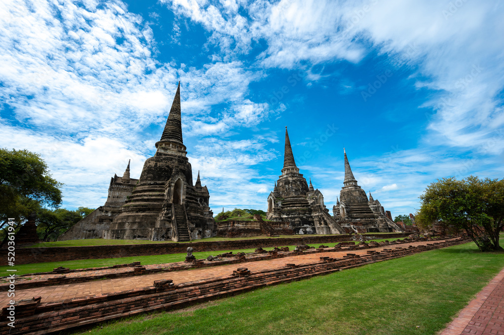 Fototapeta premium Landscape the ruins of ancient city of ayutthaya (Ayutthaya Historical Park) are the famous sightseeing place at Phra Nakhon Si Ayutthaya Province, Thailand. (Public domain)
