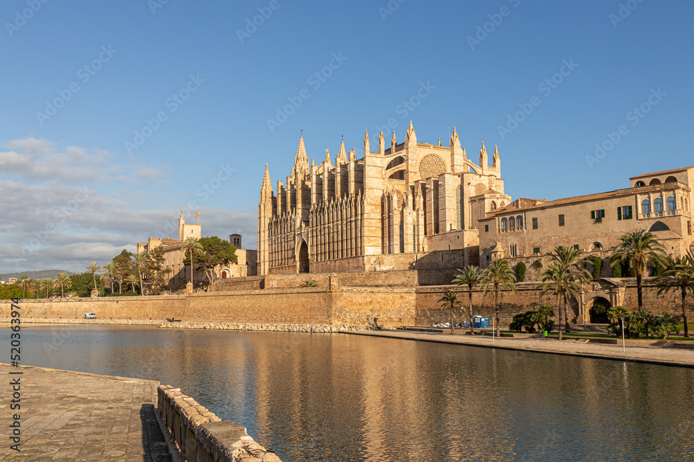 Palma de Mallorca, Spain. Facade and rose window called Ojo del Gotico (Gothic Eye) of the Santa Maria Cathedral, and Parc de la Mar