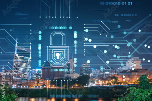 Panoramic view of Broadway district of Nashville over Cumberland River at illuminated night skyline, Tennessee, USA. Padlock hologram. The concept of cyber security to protect confidential information