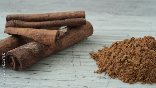 Ground cinnamon and cinnamon sticks (Cinnamomum zeylanicum) photo
