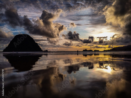 Sunset reflection at red island beach