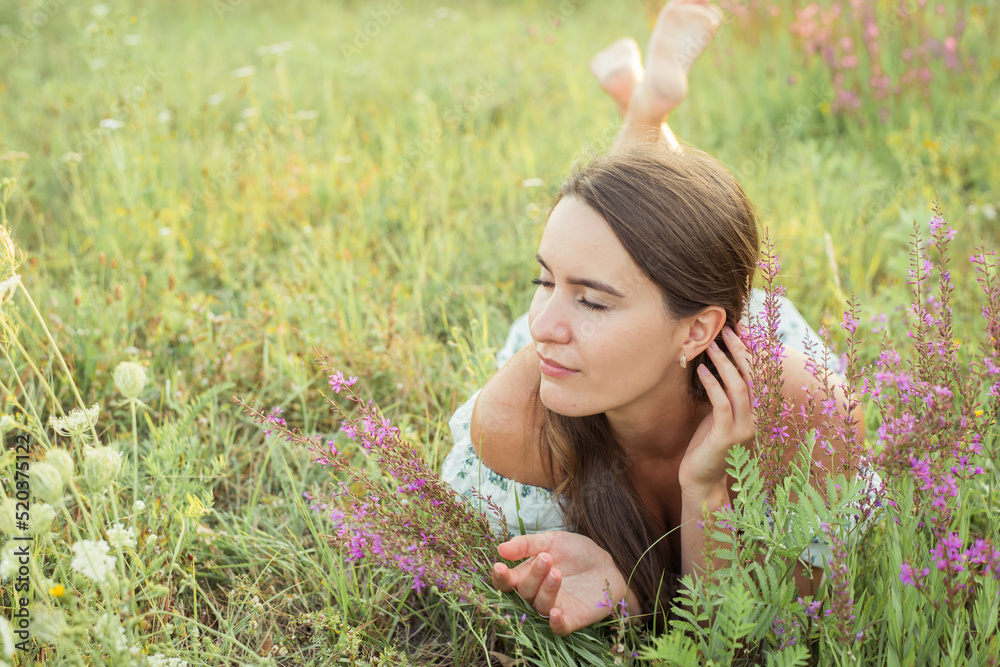 woman in field in nature with a straw hat woman in field in nature with a straw hat