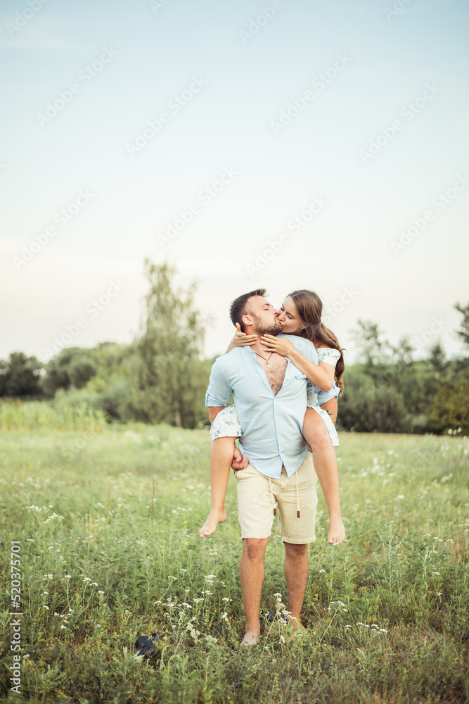 woman and bearded man on field nature picnic