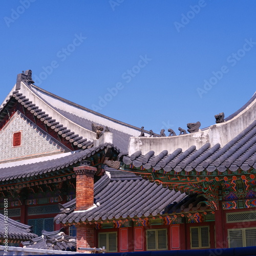 The clear sky, the wonderful tiled roof of Changdeokgung and the architecture Korean traditional old palace