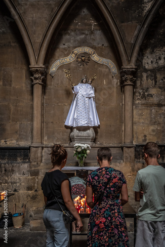 Prayer in front of Notre-Dame du Bon Secours, the Black Virgin of Saint-Etienne Cathedral in Metz