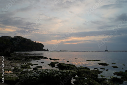 Beach sunset on a cliff in Uluwatu, Bali