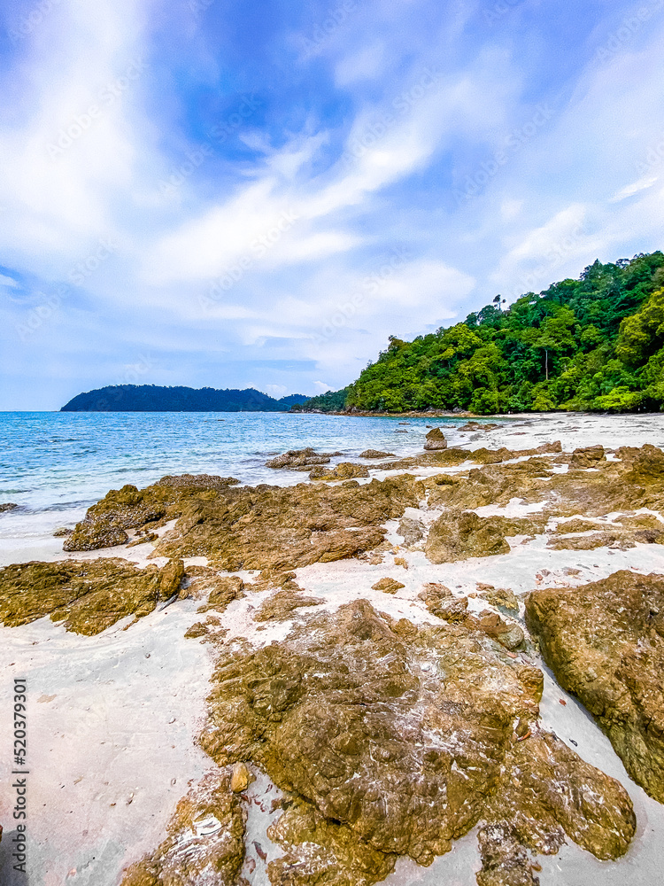 Koh Phayam beach Hin Talu with rock arch formation in Ranong, Thailand.