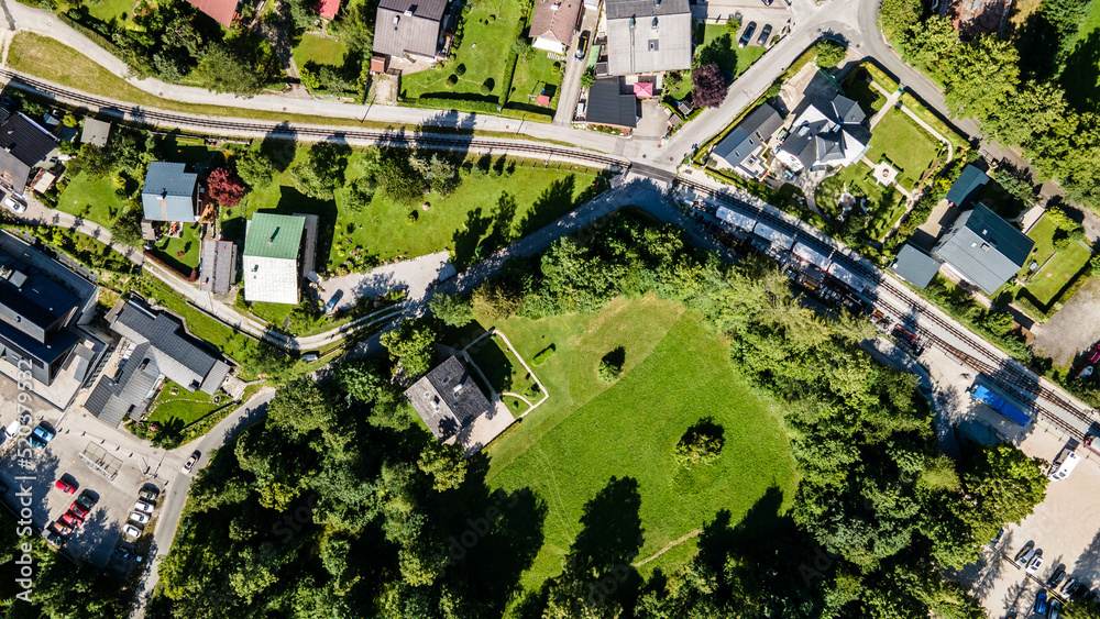 Hallstatt in summer, Salzkammergut, Austria, aerial dron view river and houses 