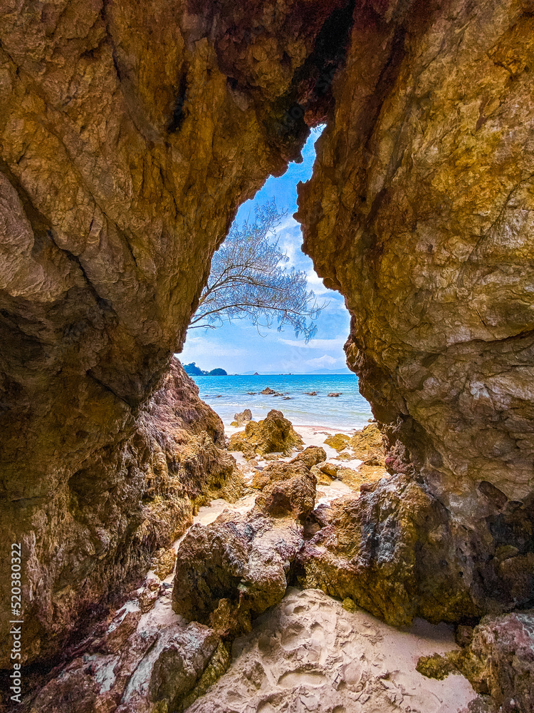 Koh Phayam beach Hin Talu with rock arch formation in Ranong, Thailand. Koh Phayam beach Hin Talu with rock arch formation in Ranong, Thailand.