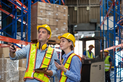 worker person working with safety in warehouse logistic factory, business manufacturing industry occupation concept, goods product box distribution. Storehouse employee in uniform. warehouse worker.