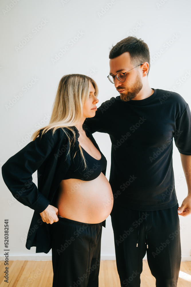 Portrait of future mother and father, husband hug pregnant wife. Happy family resting at home
Portrait of future mother and father, husband hug pregnant wife. Happy family resting at home
