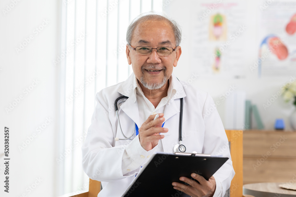 Camera view Asian doctor man smile meeting online with patient to consult health for healthy wellness life. Senior Doctor wearing white coat with stethoscope Video Call at hospital. Telehealth concept Camera view Asian doctor man smile meeting online with patient to consult health for healthy wellness life. Senior Doctor wearing white coat with stethoscope Video Call at hospital. Telehealth concept