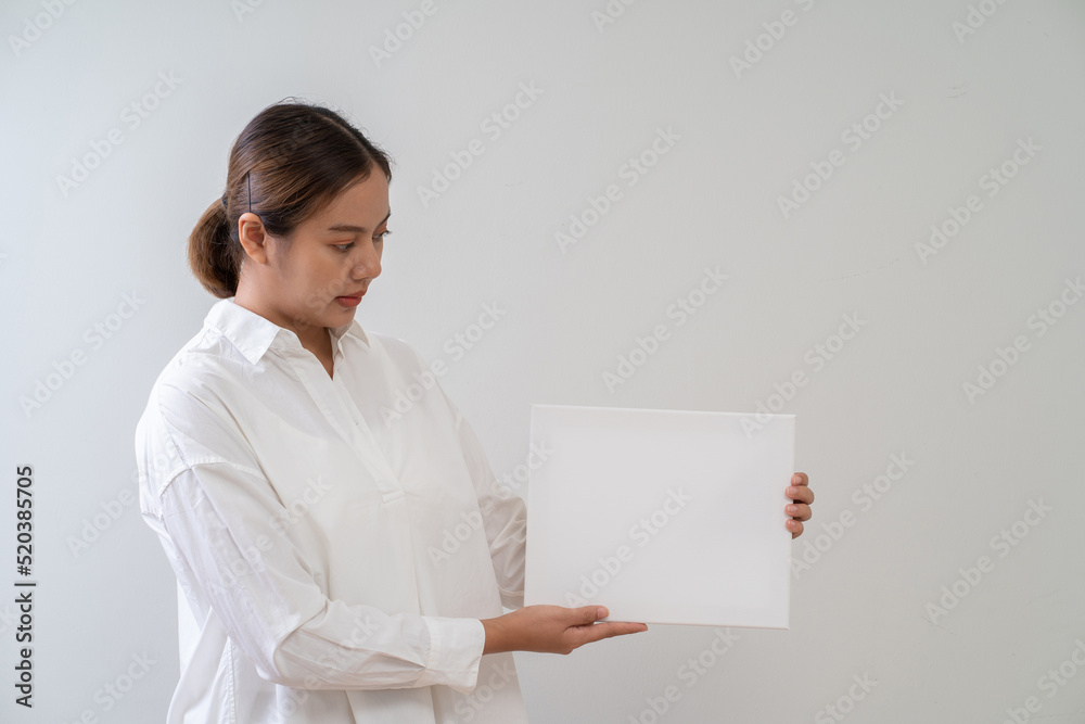 Asian woman holding white board. Advertising copyspace Asian woman holding white board. Advertising copyspace