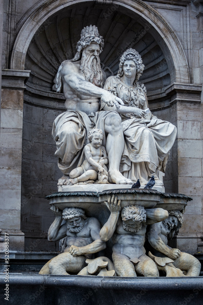 Statues of Neptune fountain at Albertina Museum on Albertinaplatz square in Innere Stadt in Old city center in Vienna in Austria. Sculptures and figures in Wien in Europe. Austrian town history. 