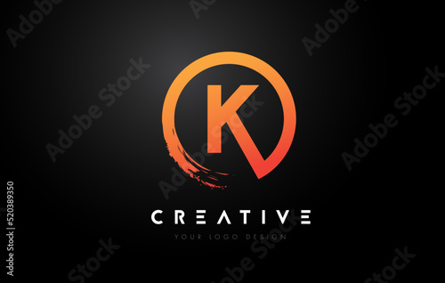Orange K Circular Letter Logo with Circle Brush Design and Black Background.