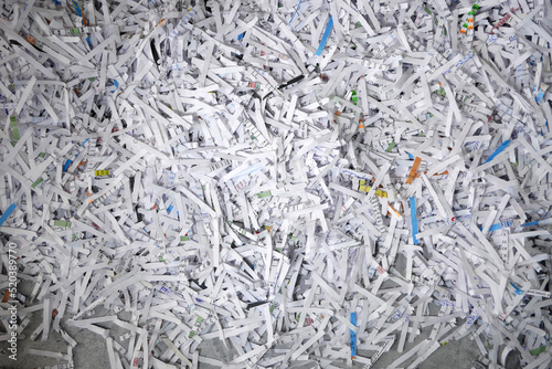 Heap of white shredded papers background,