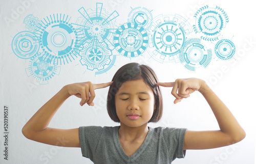 Asian girl closes her eyes and analyzes her thoughts , isolated  white concrete wall and HUD element. Education concepts with  copy space for text.