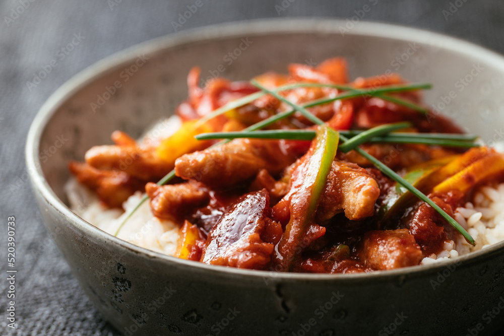 Textured vegetable protein (TVP) with a spicy Chinese plum sauce with bell peppers on rice Textured vegetable protein (TVP) with a spicy Chinese plum sauce with bell peppers on rice