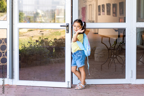 Back to school. Portrait of a smiling young girl on the first day of school.