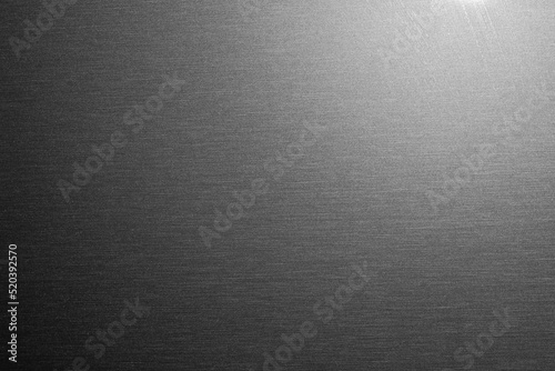 flat sheet of metal with light, used as a background