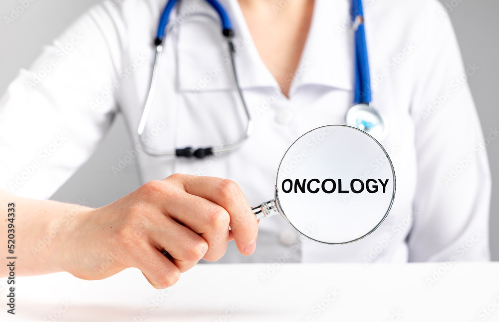 Oncology word. Cancer text in doctor hands. High quality photo