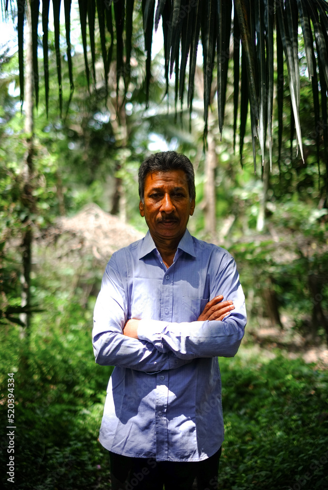 Portrait of south asian confident village man wearing shirt, Bangladeshi rural male in traditional dress Portrait of south asian confident village man wearing shirt, Bangladeshi rural male in traditional dress