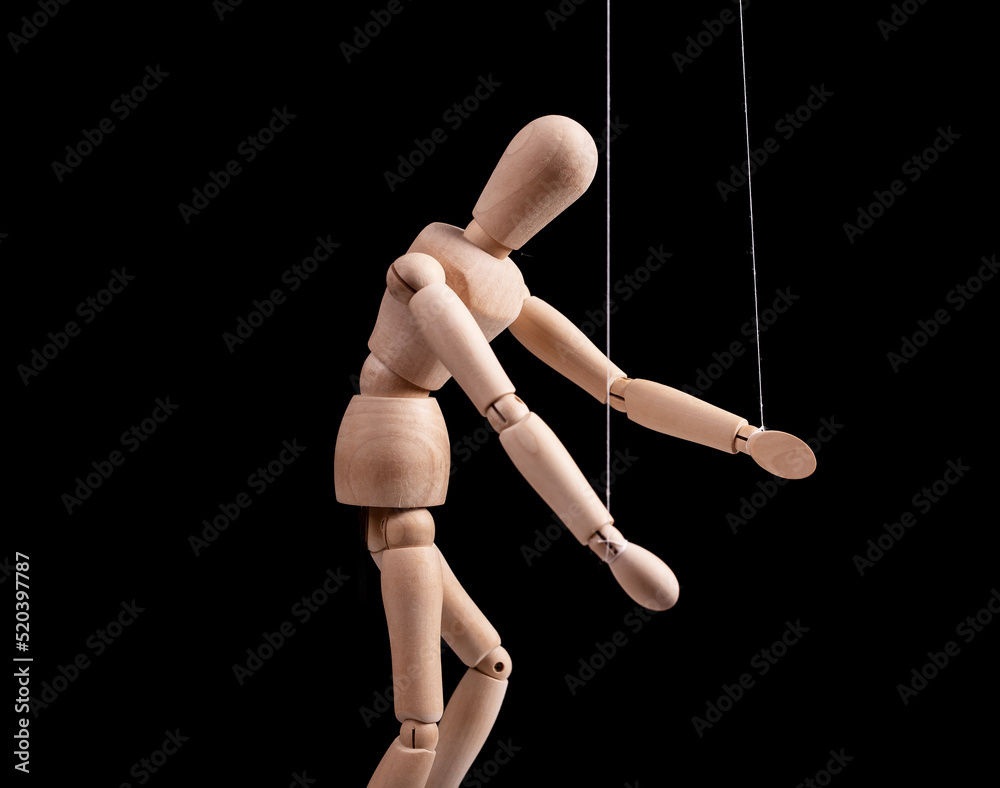 Puppet under manipulation control concept. High quality photo Puppet under manipulation control concept. High quality photo