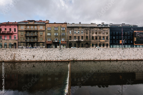 River And Street View Of Sarajevo, Houses, Miljacka river, Bosnia And Herzegovina. Overcast Autumn Day.