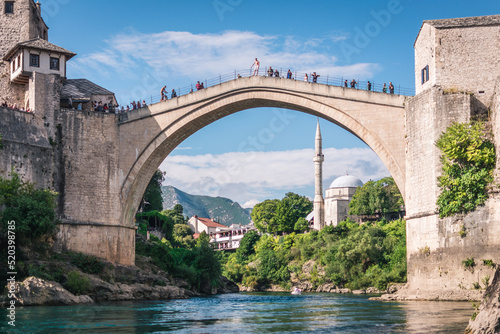 MOSTAR, BOSNIA AND HERZEGOVINA - September 21, 2021: Man is preparing to jump from Stari most, Old Bridge, in Mostar. Bosnia and Herzegovina