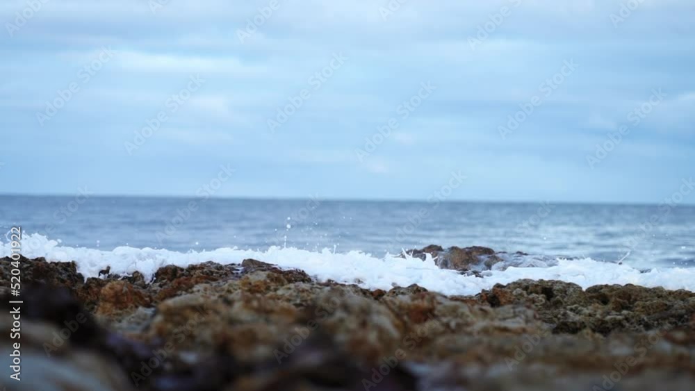 waves roll in and water moves on the sand, calming. waves roll in and water moves on the sand, calming.