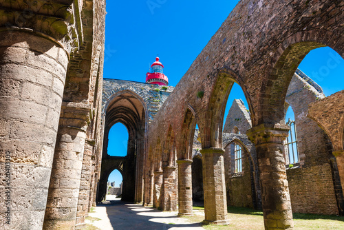 Ruins of Saint Mathieu abbey in Finistere and the top of a lighthouse photo