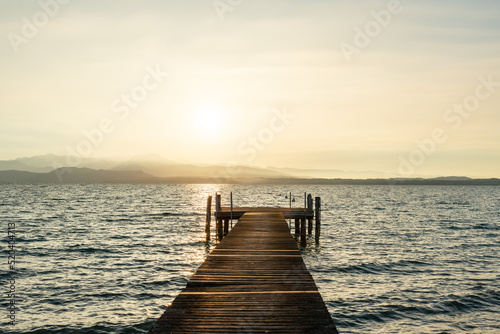 Pier on Garda lake at sunset  meditation background