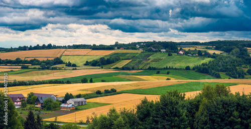 Obraz na płótnie A beautiful panorama of the West Roztocze. Undulating hills, fields and forests. A farm among the fields. Roztocze is known as Poland's Tuscany. Hosznia Ordynacka, Poland w salonie