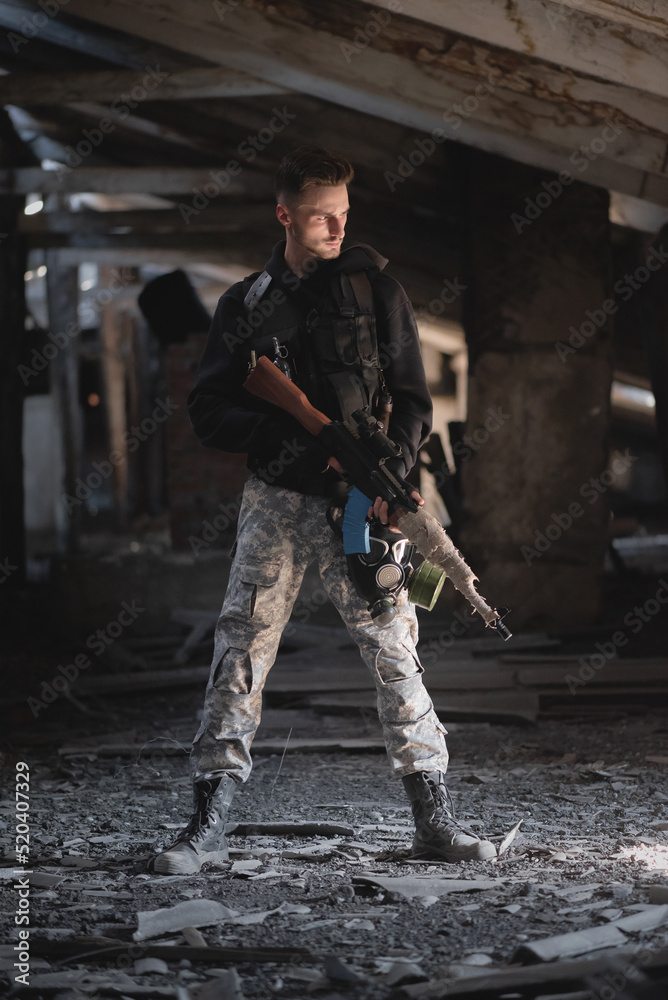 Fototapeta premium Soldier in the abandoned building. Post apocalypse soldier concept.