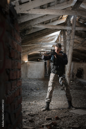 Soldier in the abandoned building. Post apocalypse soldier concept.