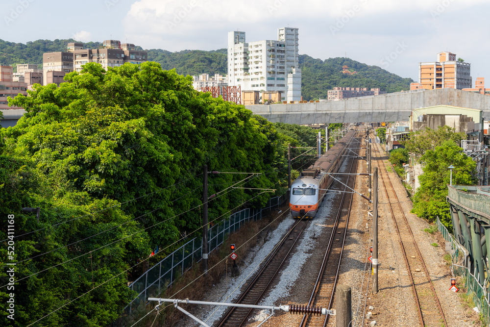 Naklejka premium Train pass though the Yingge District in Taiwan